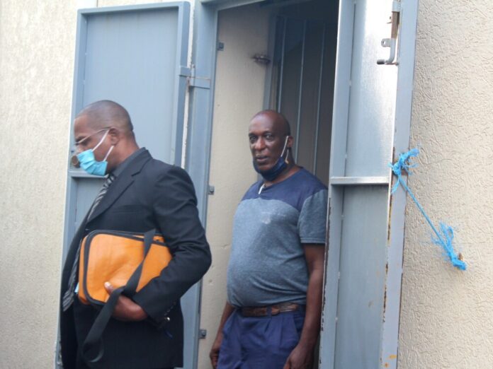 Riviere Sebastian with lawyer Wayne Norde coming from court