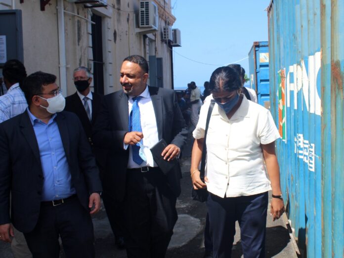 Indian officials and Dominican lawyer outside the court Indian lawyer Giani (center) and other Indian officials