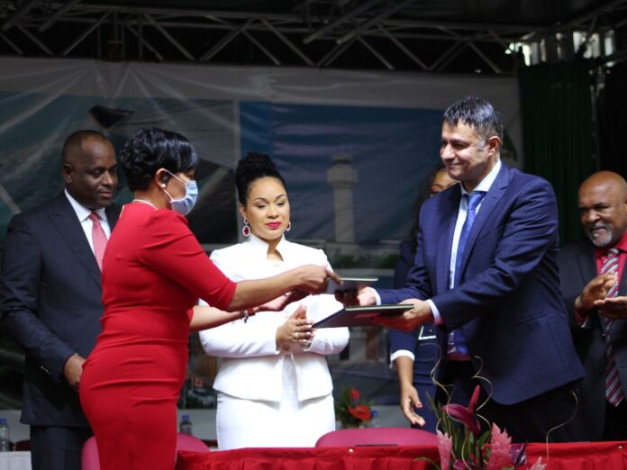 PS Messi Henderson (red dress) and MMC Manger exchange contracts