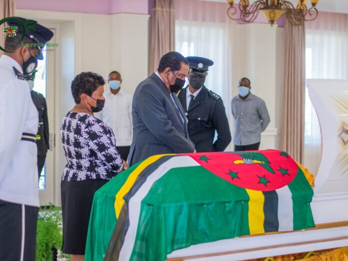 President Savarin and wife viewing body