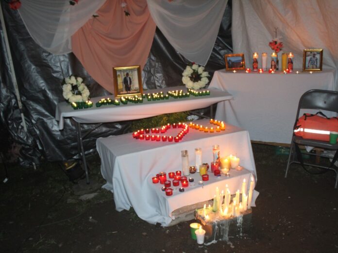 Candles at vigil for Daniel Panthier