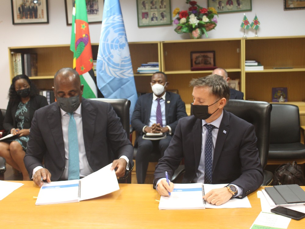 PM Skerrit and Didier Trebucq signs document