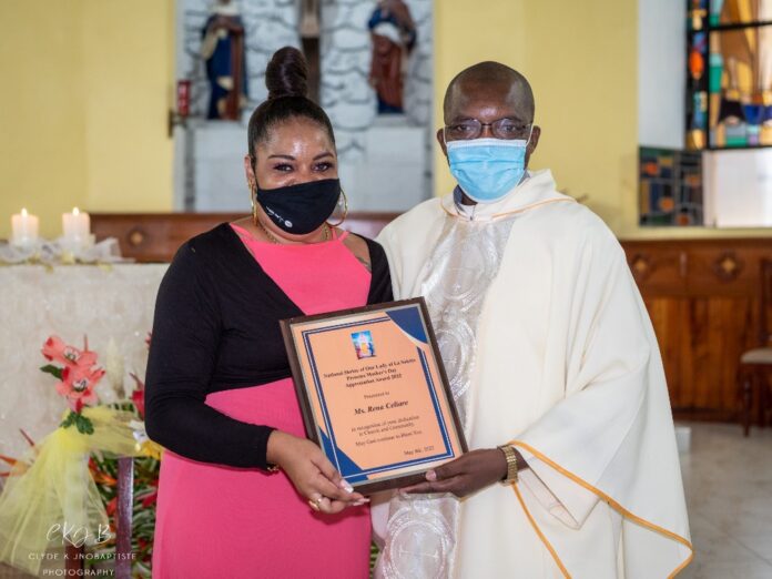 Fr Peter hands over award