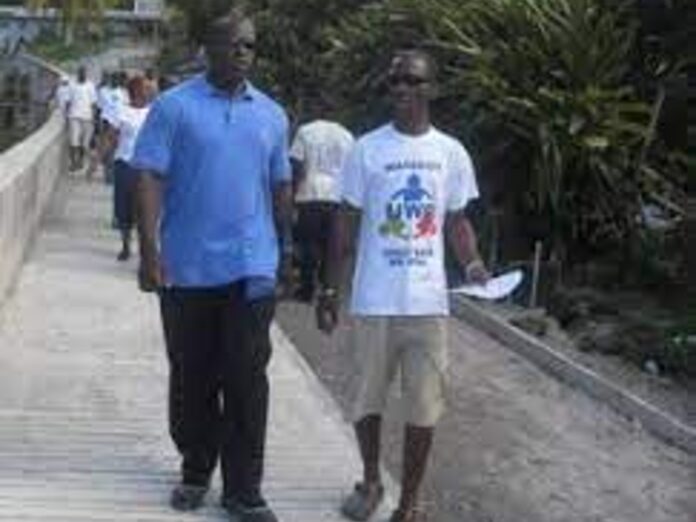 Blue shirt former UWP Leader Lennox Linton with brother Brian