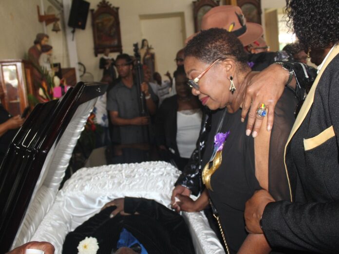 Wife Shirley pays final respects