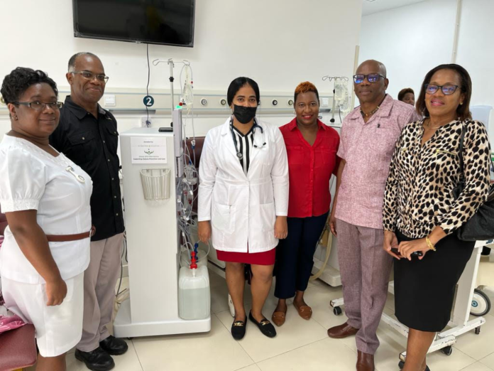 From left to right in front of one of the two DSAA Dialysis Machine donated to the Dominica China Friendship Hospital, Nurse Nioka Shillingford, DSAA 2nd Vice President Keith Benjamin, Nephrologist Dr. Giraudel, Maria Holder Memorial Trust CEO Ms. Ruchelle Roach, DSAA Dialysis Committee Member Dr. Damien Dublin and DSAA Recording Secretary Ms. Helen Mellow-Pascal