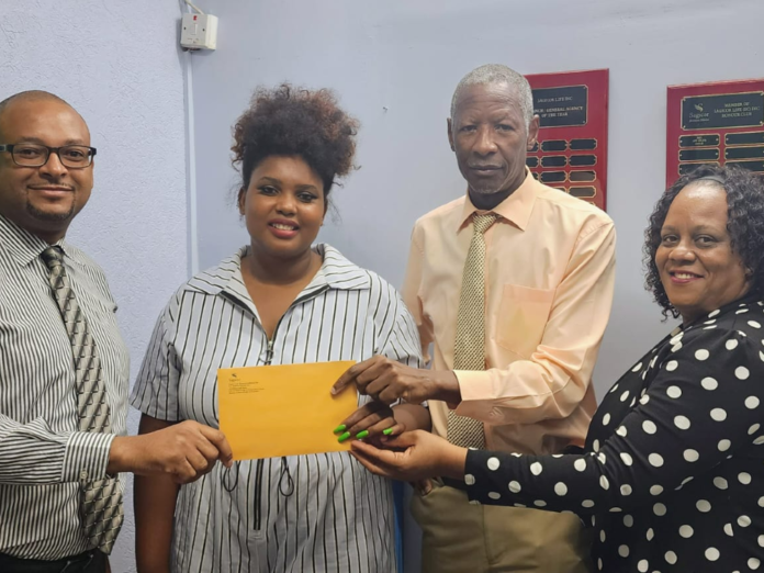 PHOTO: From left, Brenton Hilaire, Agency Manager, Sagicor Life (Eastern Caribbean) Inc Dominica shares a moment with Julie Roberts of the Julie Roberts Foundation, and Sagicor Life Advisors Geoffrey Graham and Nalda Rodney-Simon
