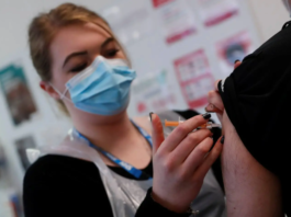 In this March 2021 file photo pharmacy technician Katrina Bonwick administers a dose of the AstraZeneca COVID-19 vaccine at the Wheatfield surgery in Luton, England. (Photo: AP)