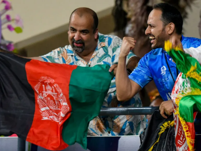 Fans cheer on Afghanistan's cricket team as they beat Australia