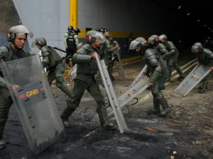 Armed police, military clear streets amid protest in Venezuela