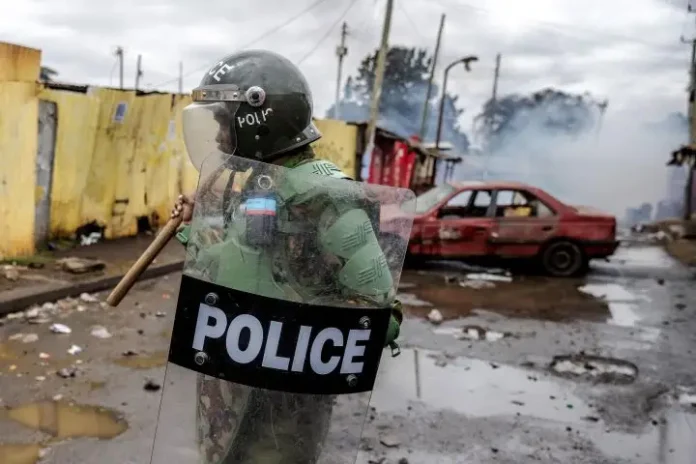 A Kenya police officer patrols next to a vandalised car that has been used as a barricade by Opposition supporters during anti-government protests in Nairobi on July 19, 2023. A Kenyan force will leave for Haiti on June 25 to lead a UN-backed, multinational mission to tackle gang violence in the Caribbean country, government and police sources said on Sunday. (Photos: AFP)