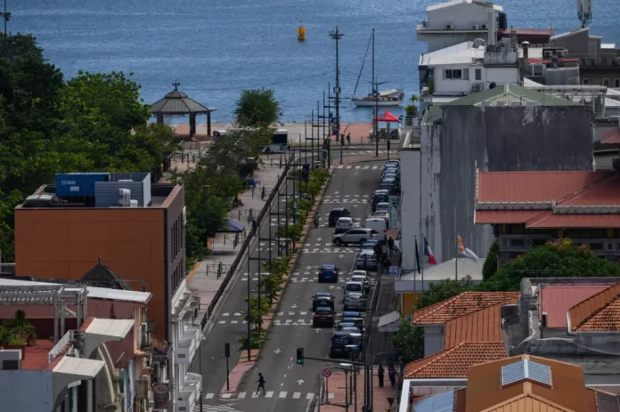 (FILES) This general view shows a street in Fort-de-France, on the French Caribbean island of Martinique on September 25, 2024. New riots in the French Caribbean island of Martinique saw one person killed by gunshot wounds, 12 police injured and stores looted, authorities said October 10, 2024. The island of 350,000 people has been shaken in recent weeks by violent protests over high prices. (Photo by Ed JONES / AFP)