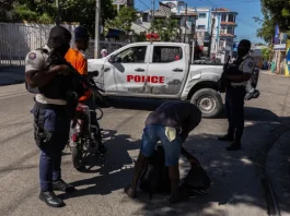 Police officers conduct searches in a suburb of Port-au-Prince, Haiti earlier this month. Guerinault Louis / Anadolu via Getty Images