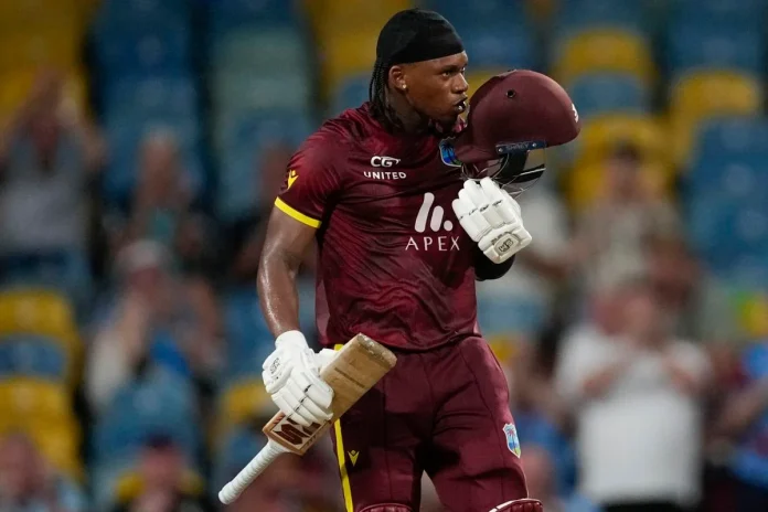 SWEET: West Indies' Keacy Carty celebrates after scoring his first One-Day International a century in the third ODI England at Kensington Oval in Bridgetown, Barbados, Wednesday night. -Photo: AP Ricardo Mazalan