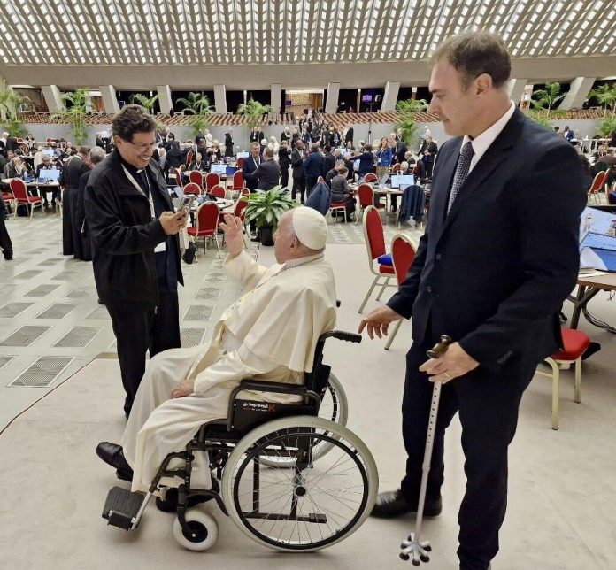 Pope Francis greets Archbishop of Port of Spain Jason Gordon, left, yesterday at The Vatican for the Sixth Synod Assembly in Rome.