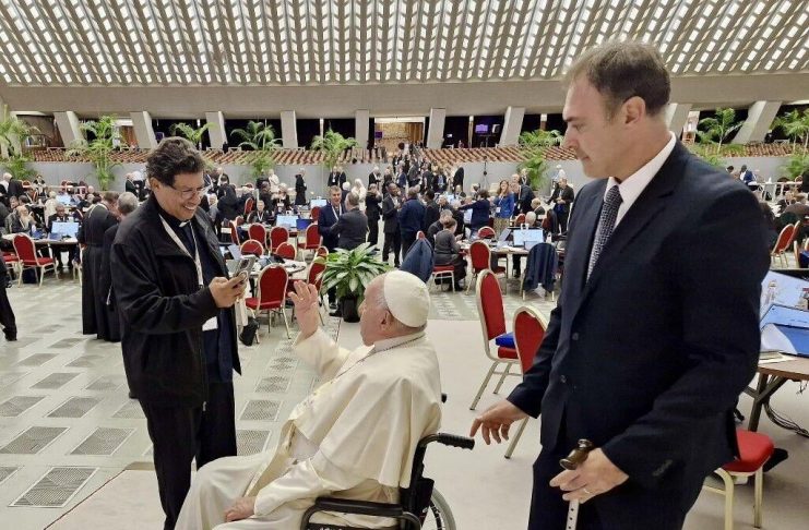 Pope Francis greets Archbishop of Port of Spain Jason Gordon, left, yesterday at The Vatican for the Sixth Synod Assembly in Rome.