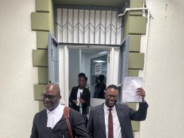 L/R Layer Letang, center (Shanice Henry) and Ronald Charles exiting the court-All photos by Carlisle Jno Baptiste of Nature Isle News (NIN)