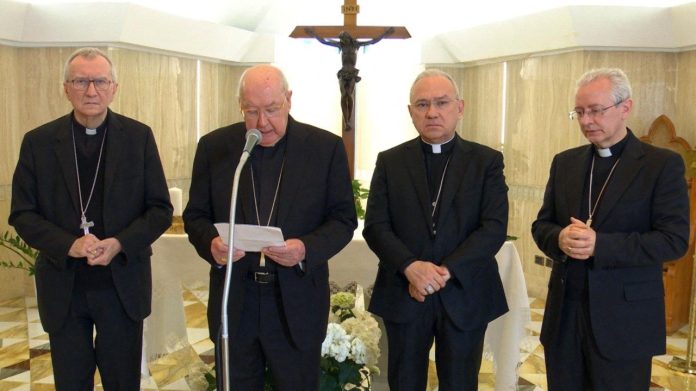 (L-R) Cardinal Pietro Parolin, Cardinal Kevin Farrell, Archbishop Edgar Peña Parra, and Archbishop Diego Ravelli stood in the Casa Santa Marta to announce the death of Pope Francis
