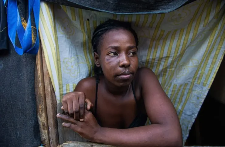 Sabrina, 25, who fled her home in the Carrefour Feuilles neighbourhood due to gang violence, stands in a newly opened shelter near the National Palace in Port-au-Prince, Haiti, on March 31, 2025.