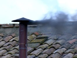 Black smoke rises