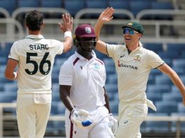 Australia’s captain Pat Cummins (R) congratulates Mitchell Starc after he dismissed West Indies’ Kevlon Anderson (C) on day three of the third Test at Sabina Park in Kingston, Jamaica, on July 14. - AP Photo