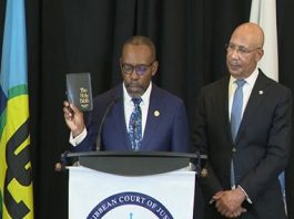 Justice Winston Anderson being sworn in as the fourth president of the Caribbean Court of Justice (CCJ) before Jamaica’s Governor