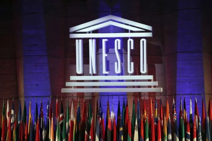 The logo of the United Nations Educational, Scientific and Cultural Organisation (UNESCO) is seen during the 39th session of the General Conference at the UNESCO headquarters in Paris, Saturday, November 4, 2017. The United States is ready to rejoin the U.N. cultural and scientific agency UNESCO â and pay more than $600 million in back dues -- after a decade-long dispute sparked by the organisation's move to include Palestine as a member. (AP Photo/Christophe Ena, File)