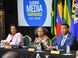 Caricom chairman and Prime Minister of Jamaica Dr Andrew Holness addressing Tuesday evening’s media briefing at the end of the 49th Regular Meeting of the Conference of Heads of Government of the Caribbean Community in Montego Bay. At centre is Caricom Secretary General Dr Carla Barnett, while at left is Lavern Reid, communication advisor to the secretary general. )Photo: Naphtali Junior)