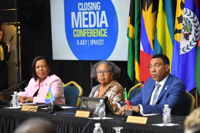 Caricom chairman and Prime Minister of Jamaica Dr Andrew Holness addressing Tuesday evening’s media briefing at the end of the 49th Regular Meeting of the Conference of Heads of Government of the Caribbean Community in Montego Bay. At centre is Caricom Secretary General Dr Carla Barnett, while at left is Lavern Reid, communication advisor to the secretary general. )Photo: Naphtali Junior)