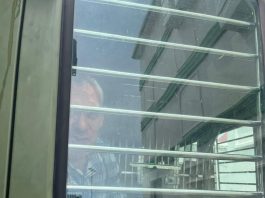 Jonathan Lehrer in prisoners van and Roberts Snider Jr ( hiding) taken back to prison