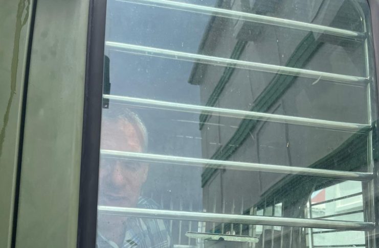 Jonathan Lehrer in prisoners van and Roberts Snider Jr ( hiding) taken back to prison