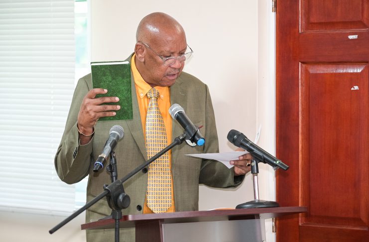 Billy Doctrove taking his oath for a third term as President of the Dominica Olympic Committee (DOC) All photos by Clyde K. Jno Baptiste of CKJB Photography
