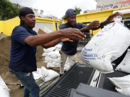Residents in Kingston prepare for the storm with sandbags