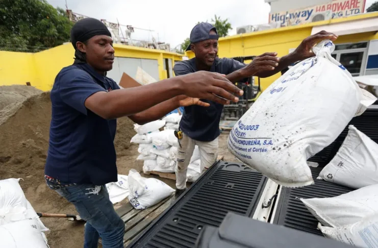 Residents in Kingston prepare for the storm with sandbags