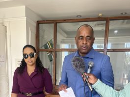 DOMINICA-POLITICS-Dominica PM urges Electoral Commission to revisit decision that could lead to disenfranchisement of voters PM Skerrit and wife Melissia speaks to the press and shows his receipt after his re-registration-photos Nature Isle News (NIN)