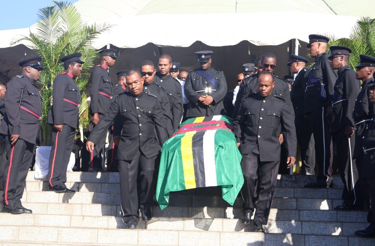 The flag draped casket of the late Julius C Timothy being carried by police officers