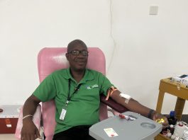 Carlisle Jno Baptiste donating blood