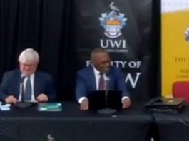 CARIBBEAN-CLIMATE-CCJ president urges regional countries to push for new climate change fund Justice Winston Anderson (right) making his presentation on Friday (CMC Photo)