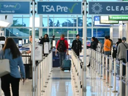US to screen for Ebola at airports, suspend visa services from outbreak areas Passengers walk-through security lines at Reagan National Airport on the first day of the US government shut down in Arlington, Virginia on October 1, 2025. (Photo by ANDREW CABALLERO-REYNOLDS / AFP)