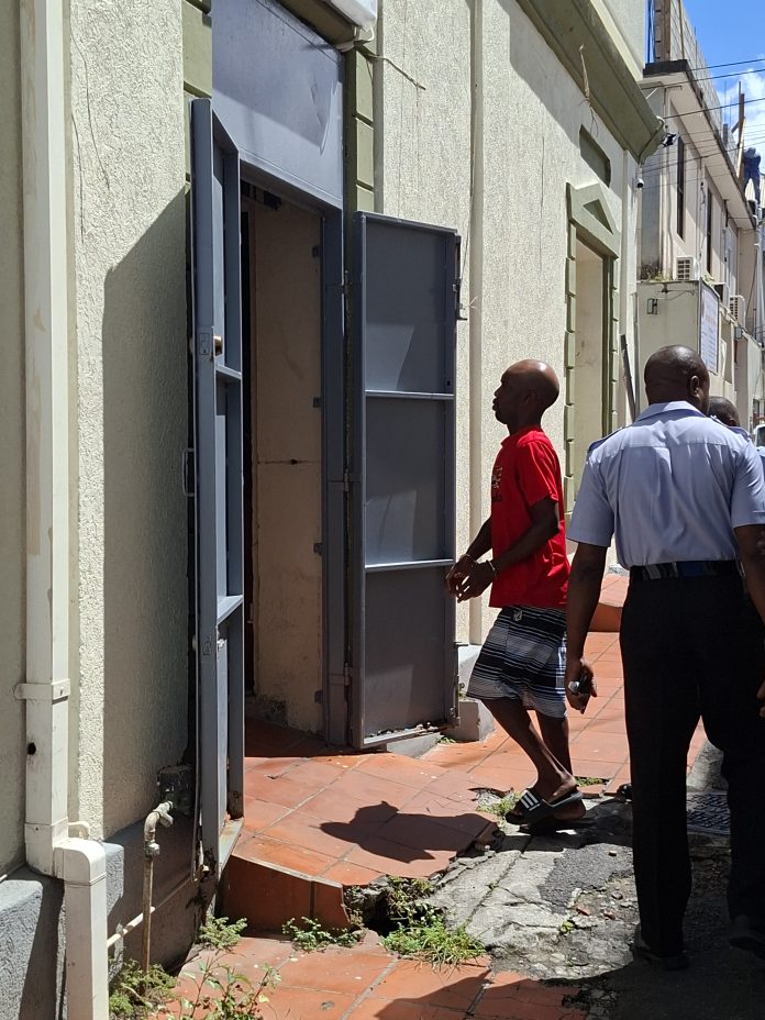 Wilson Joseph being escorted to court