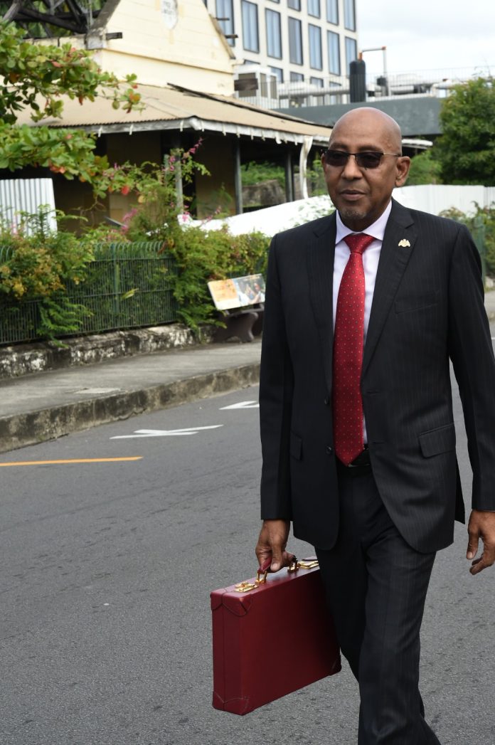 Finance Minister Dr. Irving McIntyre presenting the 2026-27 national budget to Parliament on Tuesday
